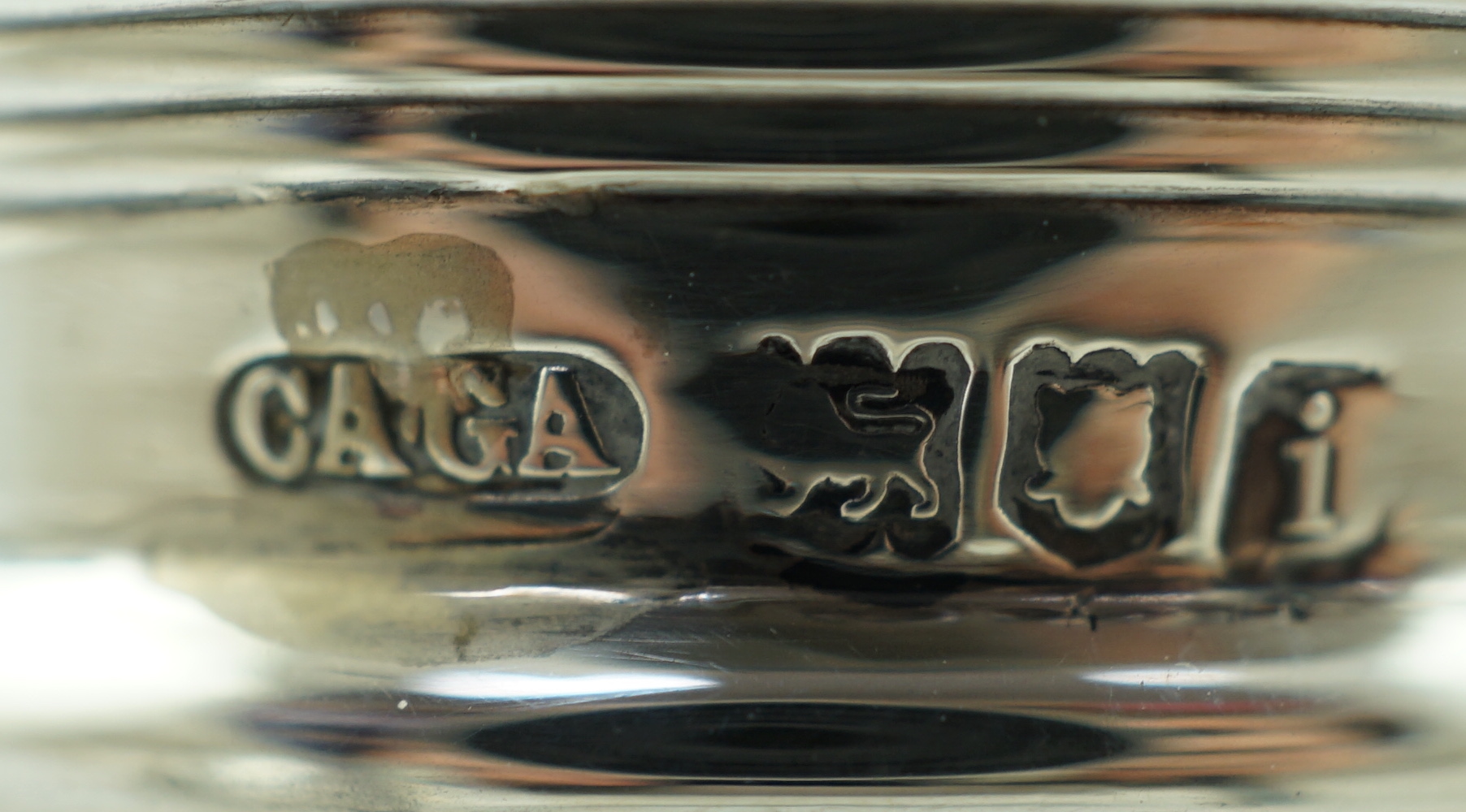 A pair of Edwardian silver mounted glass decanters, with stoppers etched 'Whisky' & 'Brandy', by Charles & George Asprey